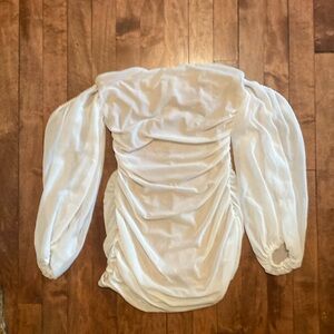 White bodycon dress with off the shoulder sleeves